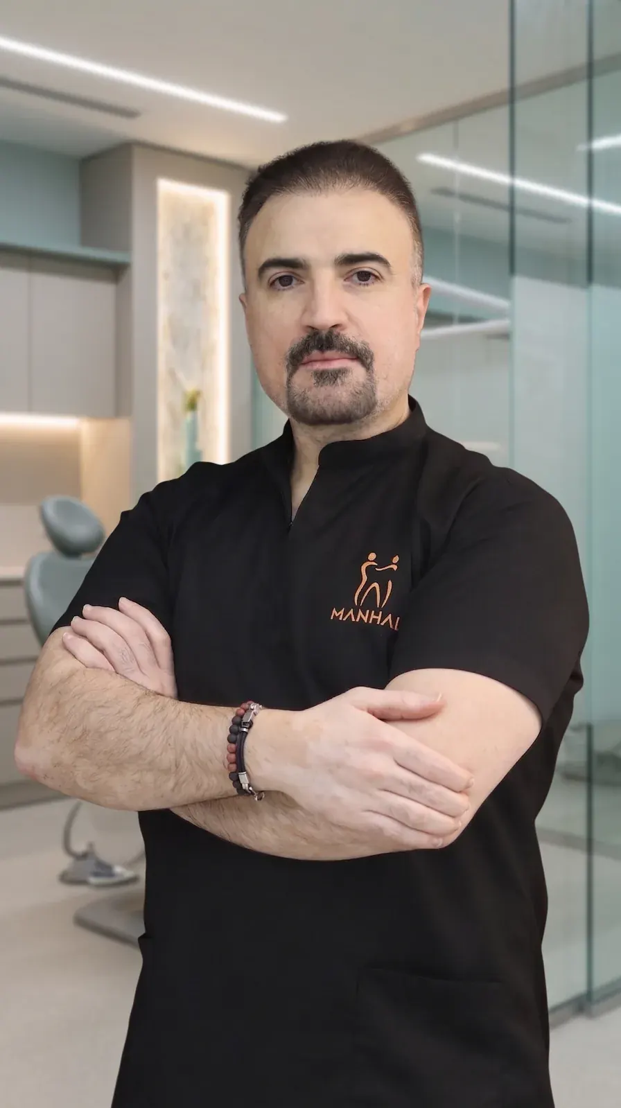 Dr. Moaiyad Pacha, Consultant Specialist Orthodontist, at Manhal Medical Center in Dubai