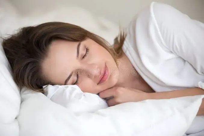 A person asleep on their side, breathing through the nose