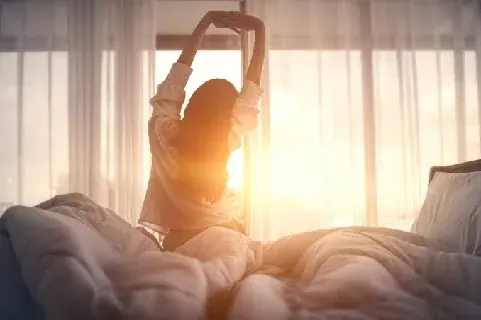 A person waking after a night of unrefreshing sleep